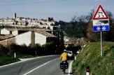 Mary, the bike and Colle Val d'Elsa in the background.